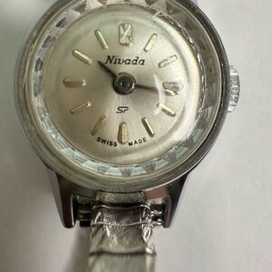 Silver Classic Swiss Design winding woman’s watch stretch band cocktail watch